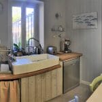 rénovation maison cuisine aménagée gris bois évier d'appoint céramique hôte plaque cuisson Villefranche-sur-Saône