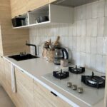 Aménagement cuisine appartement à Brié-et-Angonnes - évier et plaque cuisson