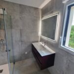Création d'une extension de maison près de Brest par illiCO travaux : nouvelle salle de bain