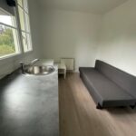 Transformation d’une maison en 4 studios à Saint-Nazaire (44) - parquet et pièce à vivre