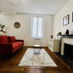 Rénovation d’un appartement à Sens (89) - salon rénové et lumineux avec tapis berbère