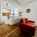 Rénovation d’un appartement à Sens (89) - cuisine bar et salon