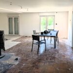 Rénovation complète de maison à Eloie (90) - pièce à vivre et sol en cours de rénovation